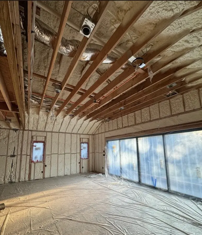Interior walls and ceiling insulated with spray foam during new construction in Hallandale Beach